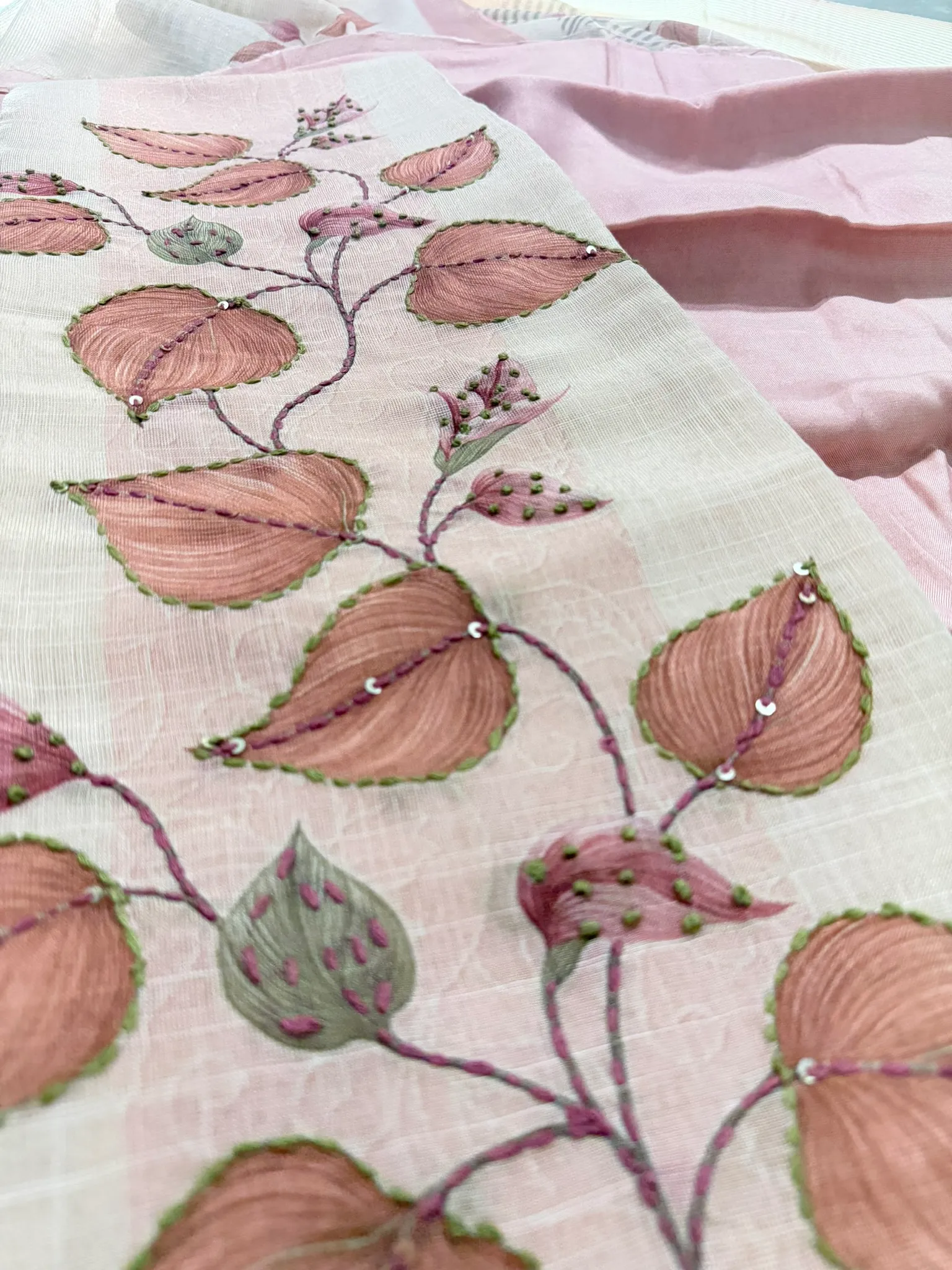 Each leaf brushed by hand, then outlined in green scallop stitch with a scatter of sequins.